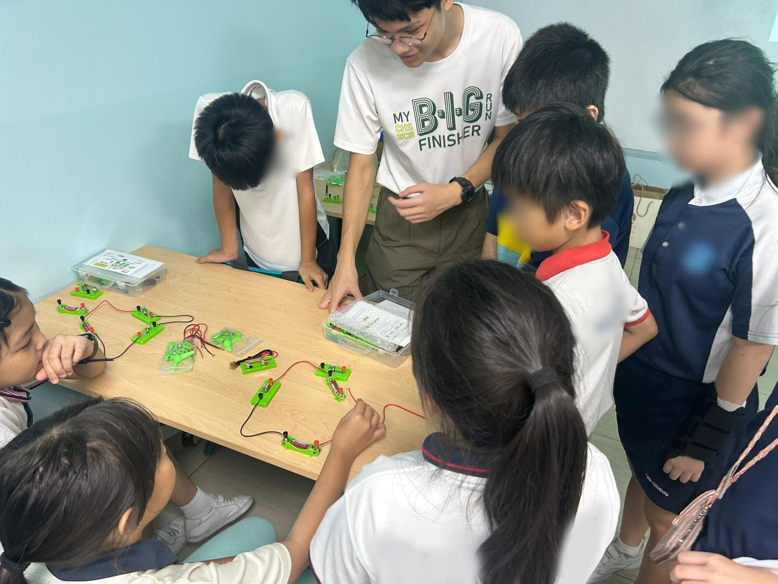 Students engaged in interactive STEM experimentation and discovery.