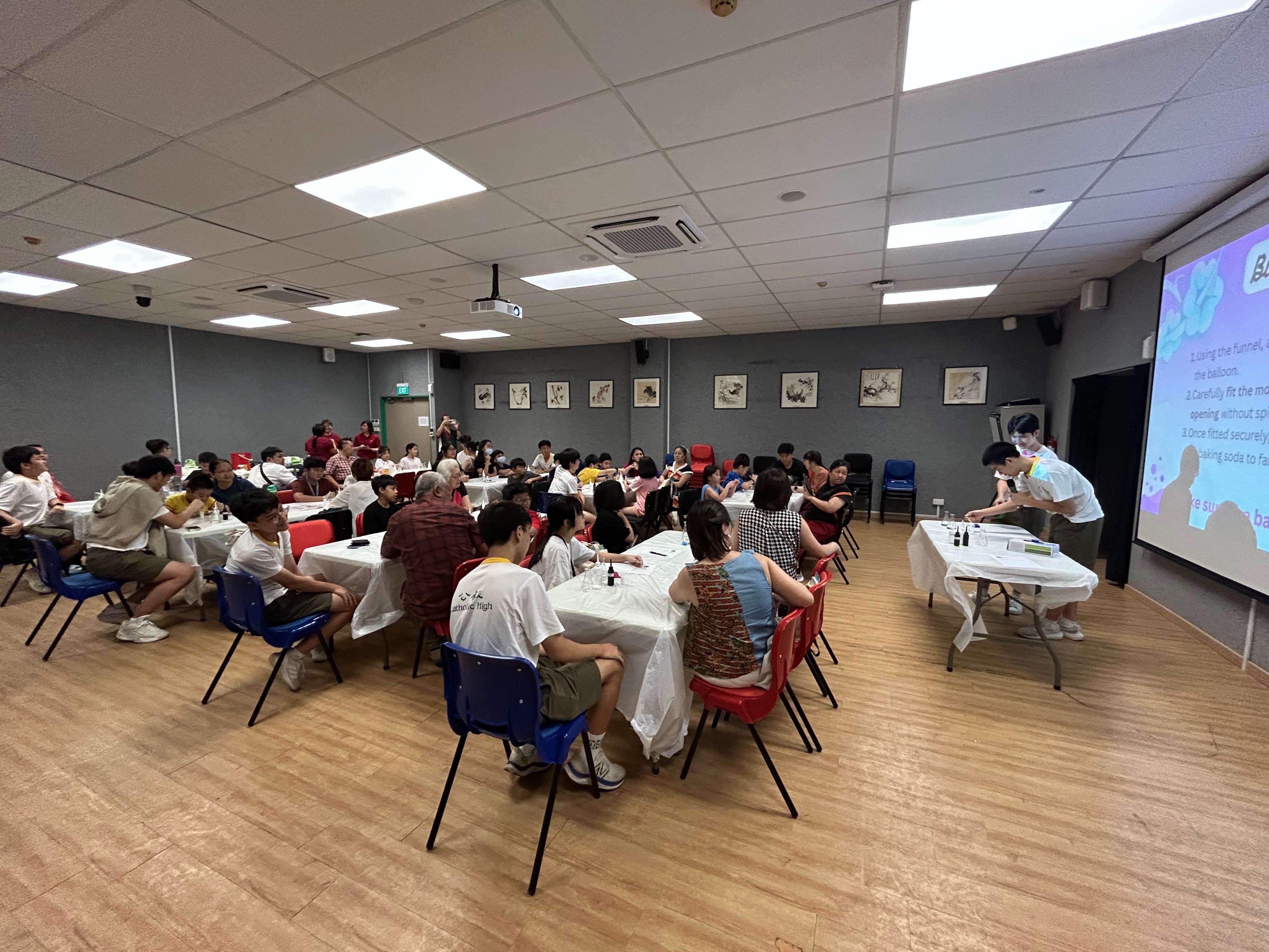 Astra volunteers mentoring young students in hands-on learning.